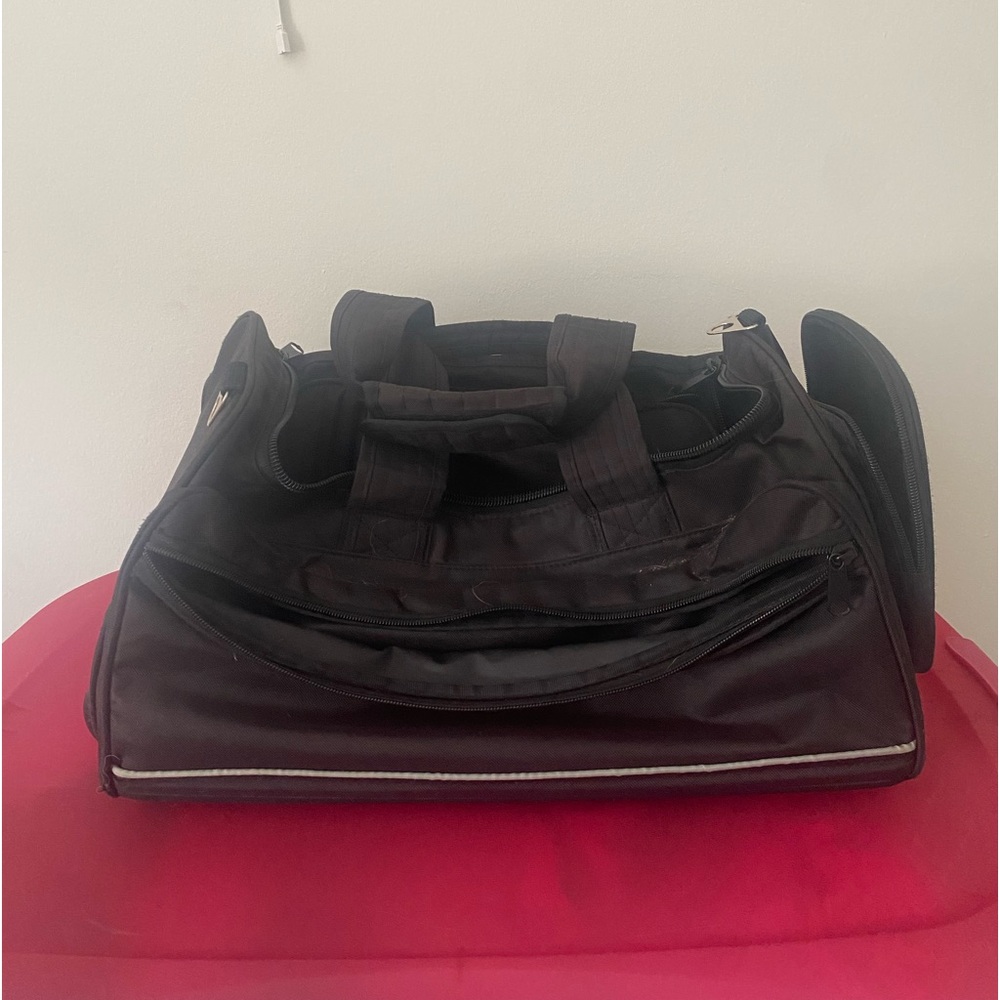 Black carryon luggage with 5 outside pockets